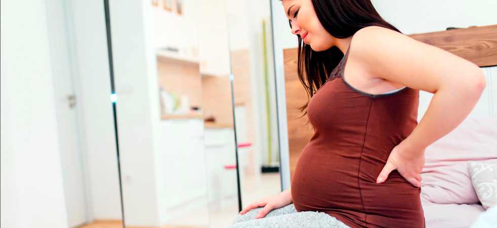 Боли в пояснице у беременных: причины и лечение - фото